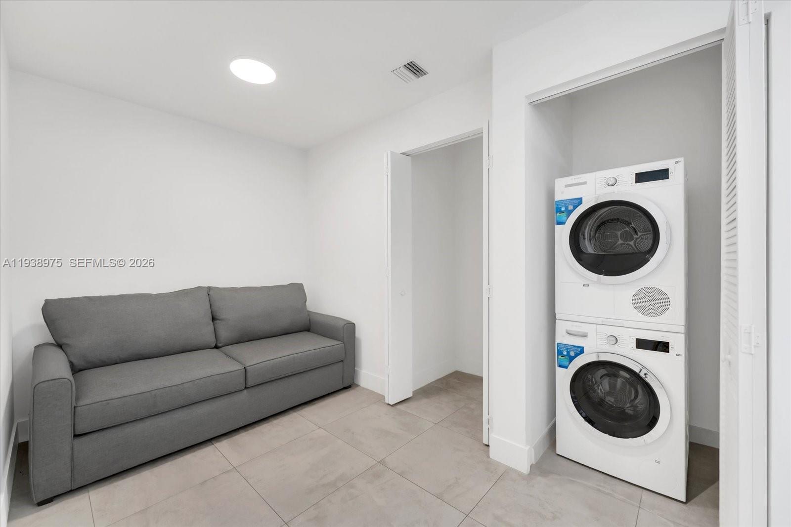239 Southwest 9th Street, Unit 1603 Miami, FL 33130 - Photo 9 of 29 a living room with furniture and a sink