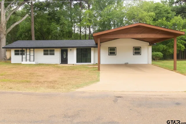 a house with trees in the background