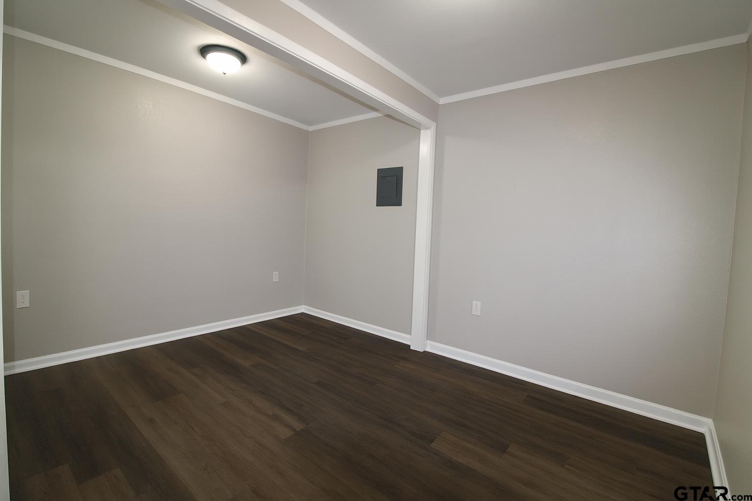 149 County Road 4237 Jacksonville, TX 75766 - Photo 13 of 19 a view of an empty room with wooden floor