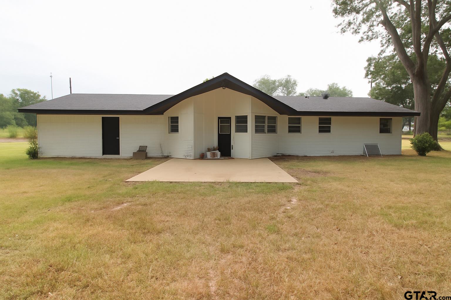 149 County Road 4237 Jacksonville, TX 75766 - Photo 18 of 19 a view of a house with a outdoor space