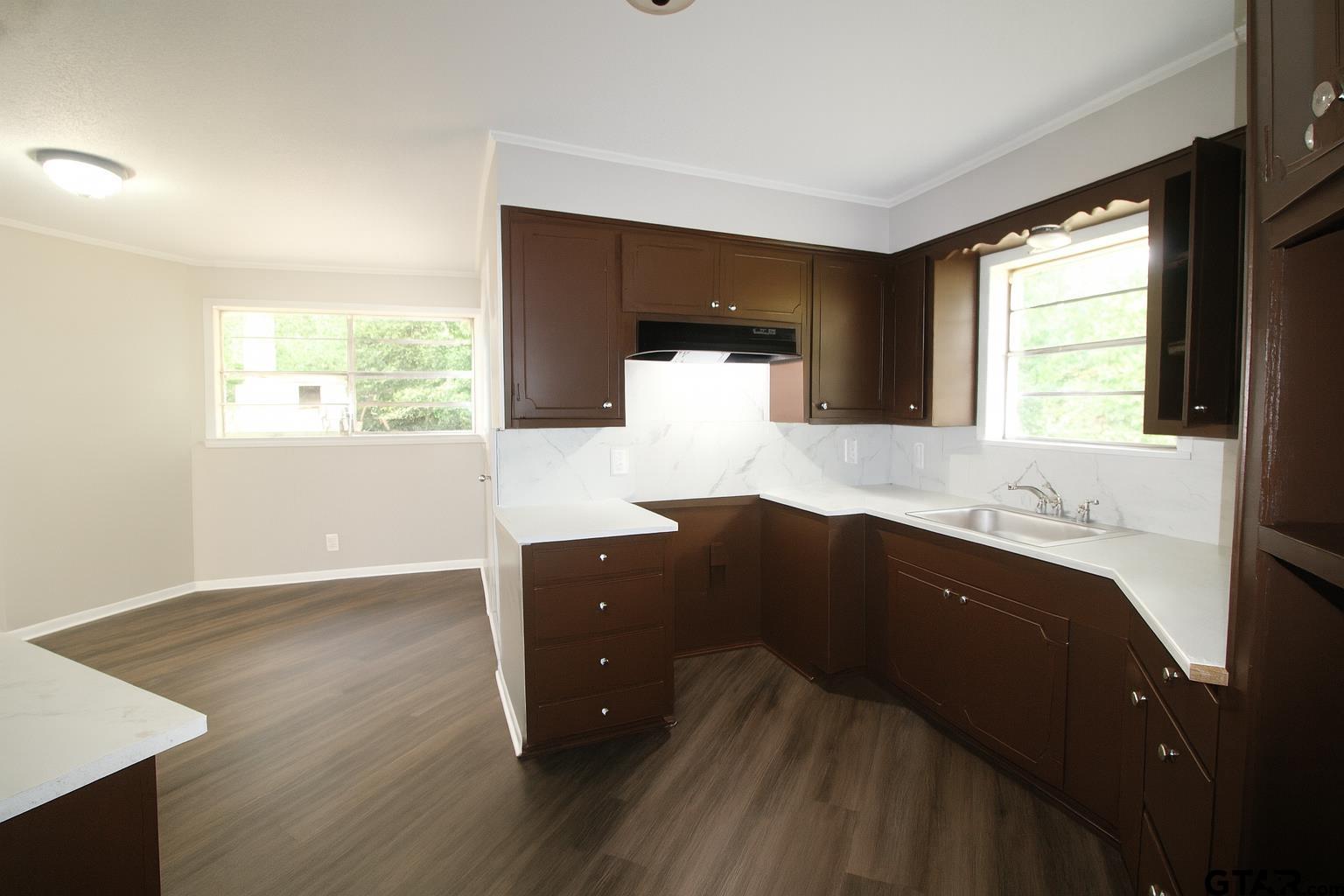149 County Road 4237 Jacksonville, TX 75766 - Photo 7 of 19 a kitchen with a sink and window