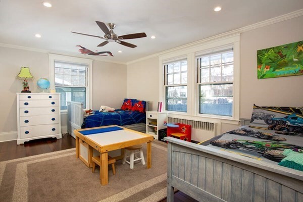 69 Evans Road Brookline, MA 02445 - Photo 12 of 24 a living room with furniture and a window