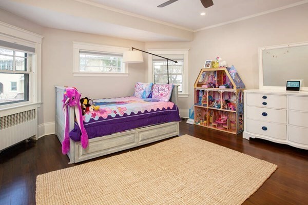 69 Evans Road Brookline, MA 02445 - Photo 13 of 24 a bedroom with furniture and window