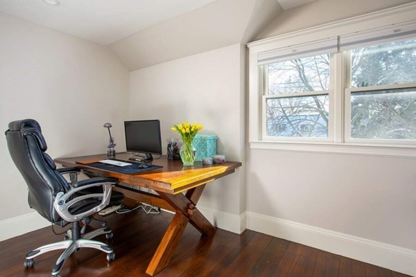 69 Evans Road Brookline, MA 02445 - Photo 17 of 24 a view of a workspace with furniture and a window