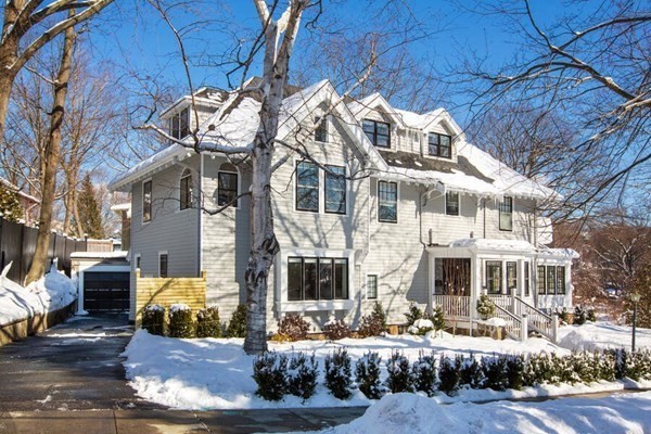 69 Evans Road Brookline, MA 02445 - Photo 2 of 24 a front view of a building with a yard