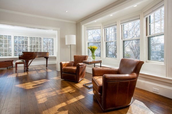 69 Evans Road Brookline, MA 02445 - Photo 3 of 24 a living room with furniture and a large window