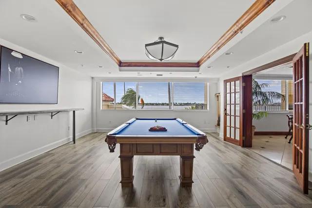 a kitchen with a sink a counter space and stainless steel appliances