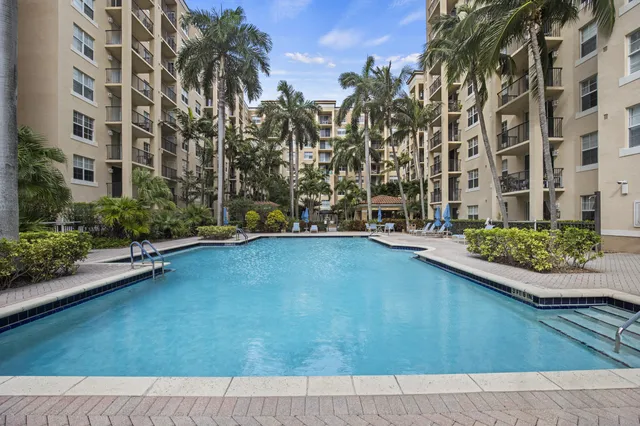 a view of a tall building with a yard