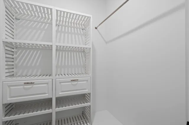 an aerial view of residential houses with outdoor space and river