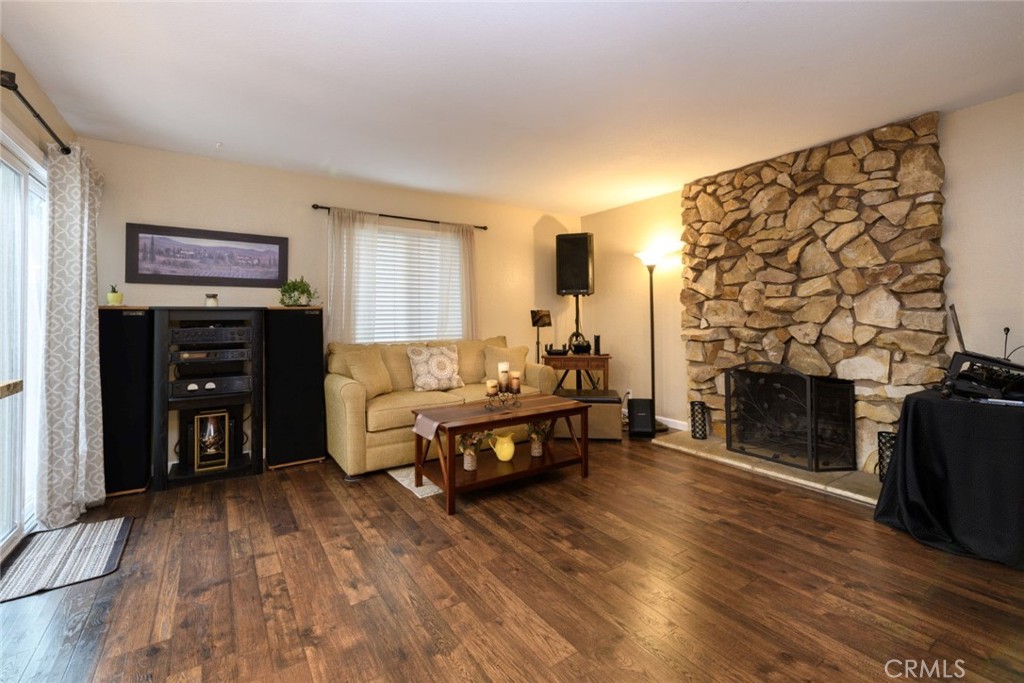 6565 Princevalle Street Gilroy, CA 95020 - Photo 11 of 27 a living room with furniture and a fireplace