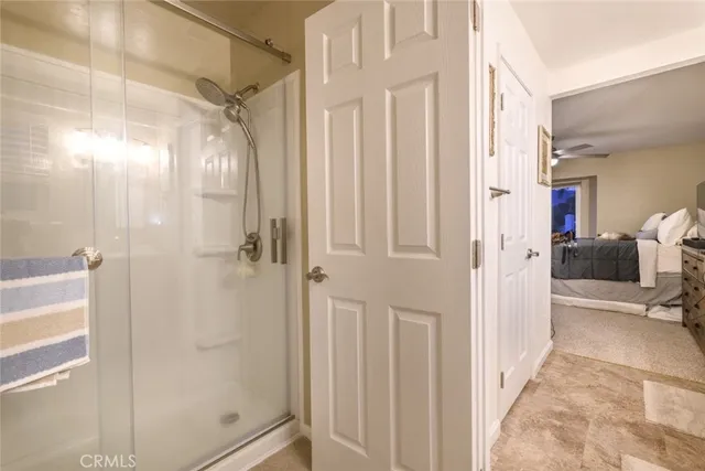 a view of a bathroom with a shower and a glass door