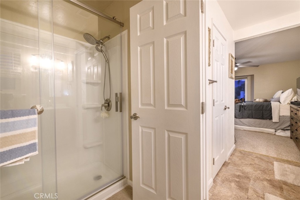6565 Princevalle Street Gilroy, CA 95020 - Photo 20 of 27 a view of a bathroom with a shower and a glass door