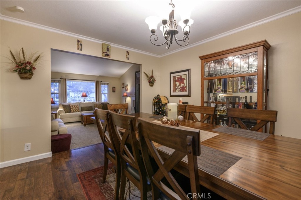 6565 Princevalle Street Gilroy, CA 95020 - Photo 9 of 27 a view of a dining room with furniture a chandelier and wooden floor
