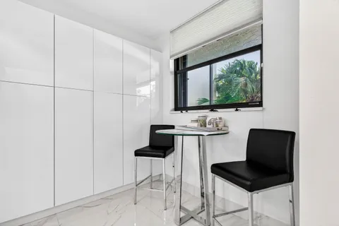 a view of a chair and table in a room