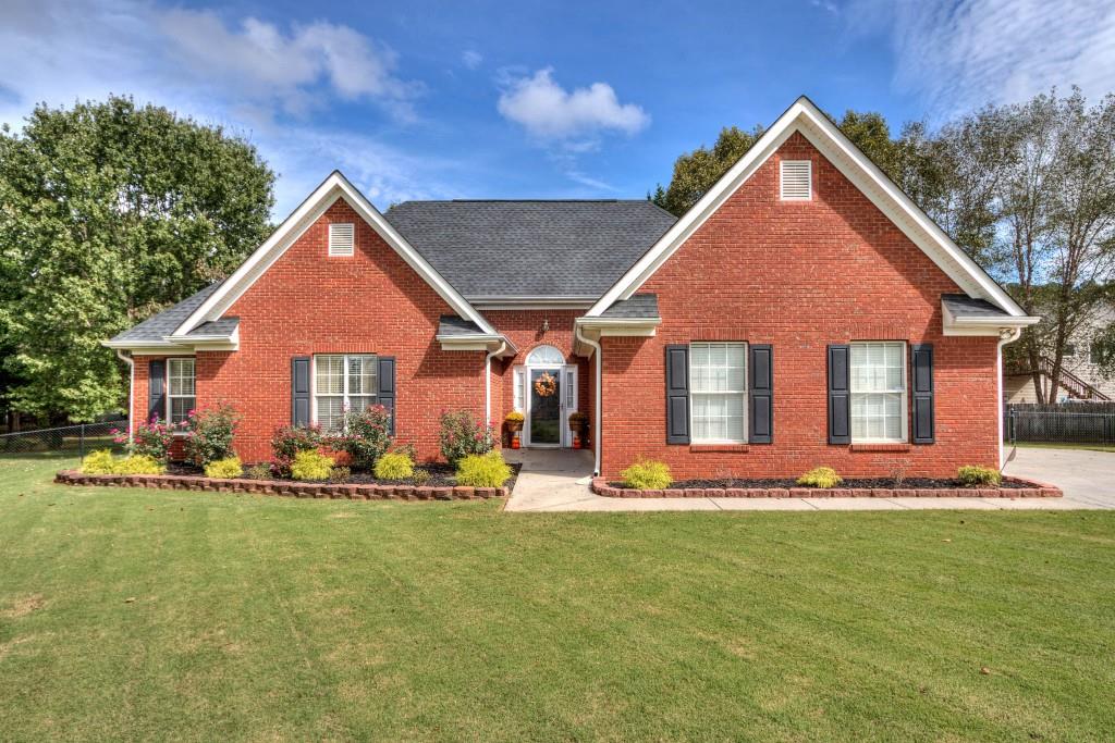 17 Derby Way Northeast Cartersville, GA 30121 - Photo 1 of 1 a front view of a house with a yard