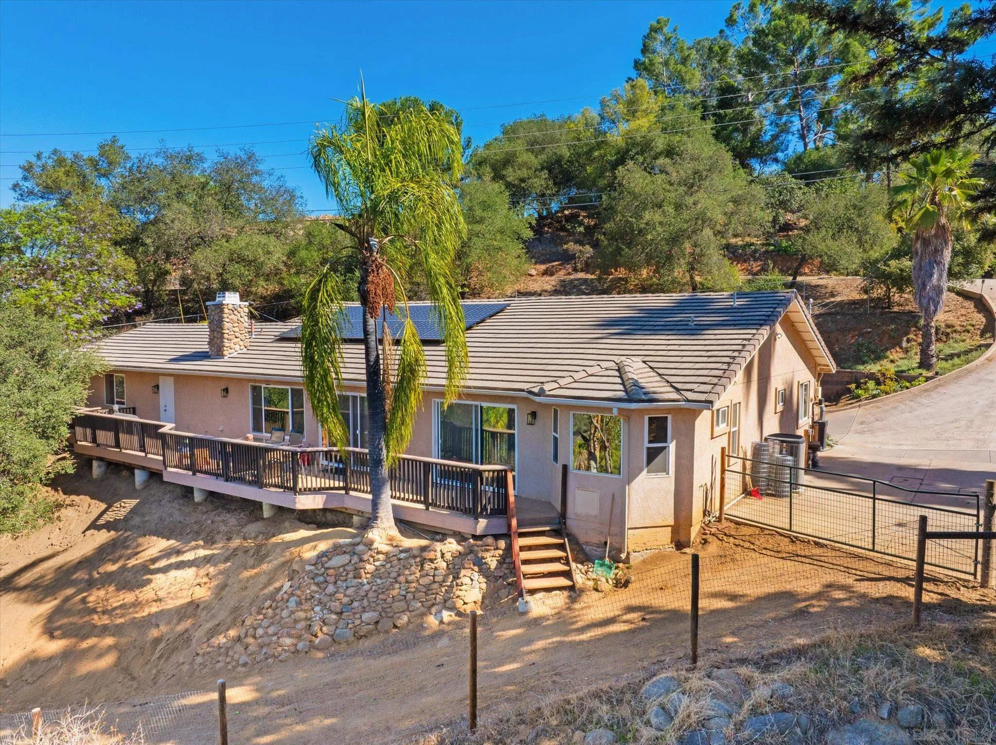 1714 Foss Road Alpine, CA 91901 - Photo 1 of 62 a view of a house with wooden fence