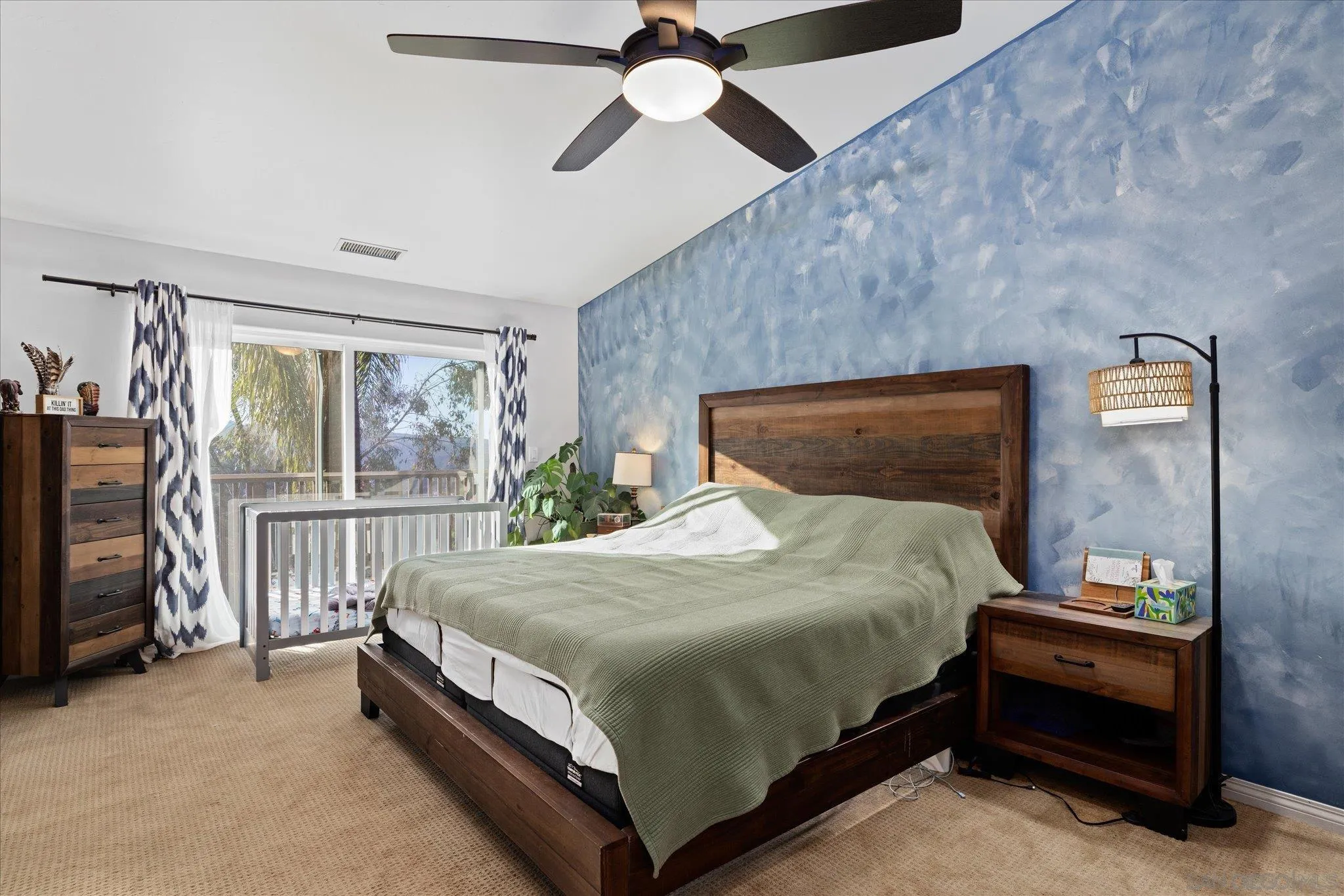 1714 Foss Road Alpine, CA 91901 - Photo 19 of 62 a bedroom with a bed and a ceiling fan