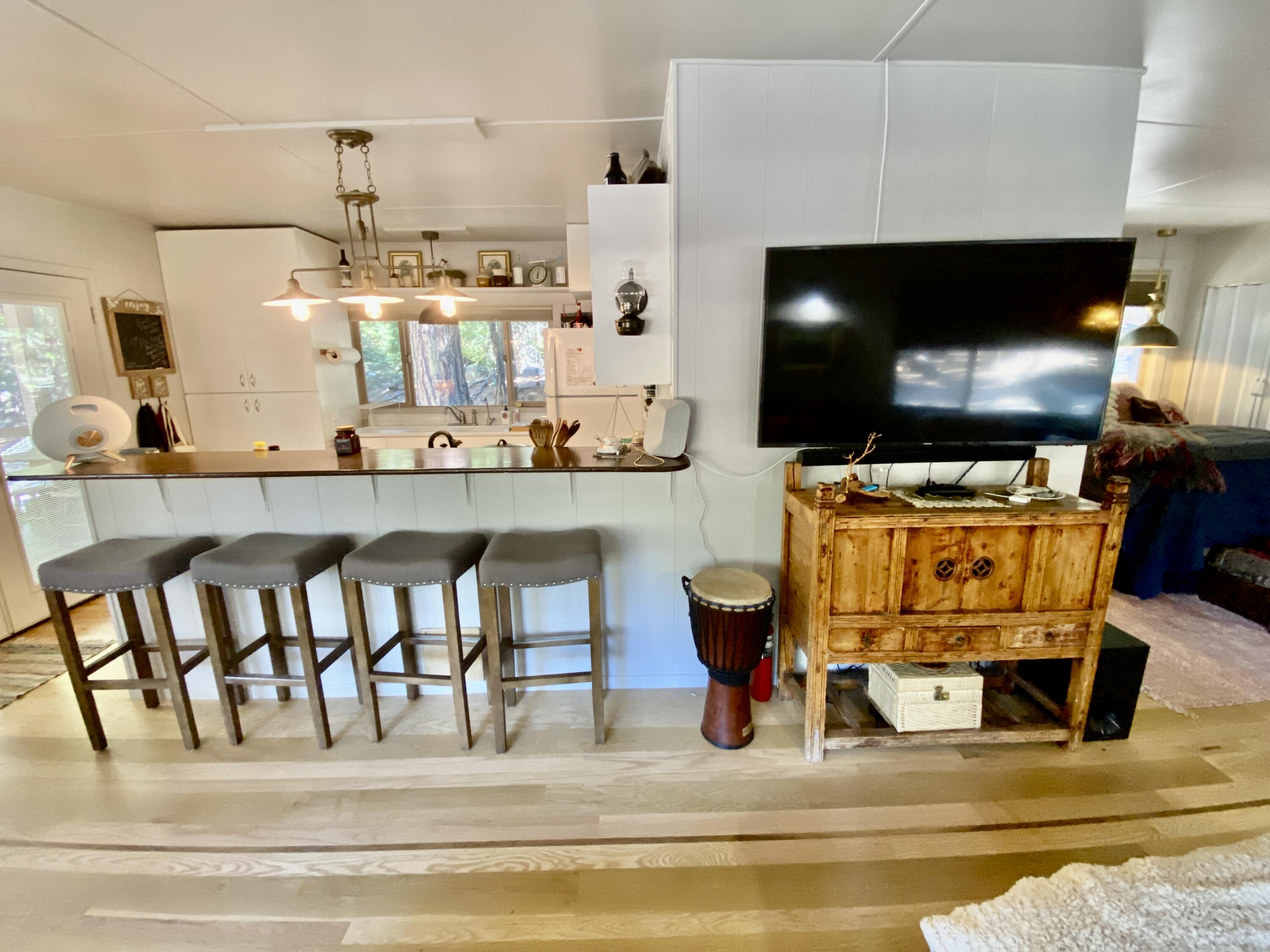 53080 4s02 Idyllwild, CA 92549 - Photo 13 of 77 a living room filled with furniture and a flat screen tv