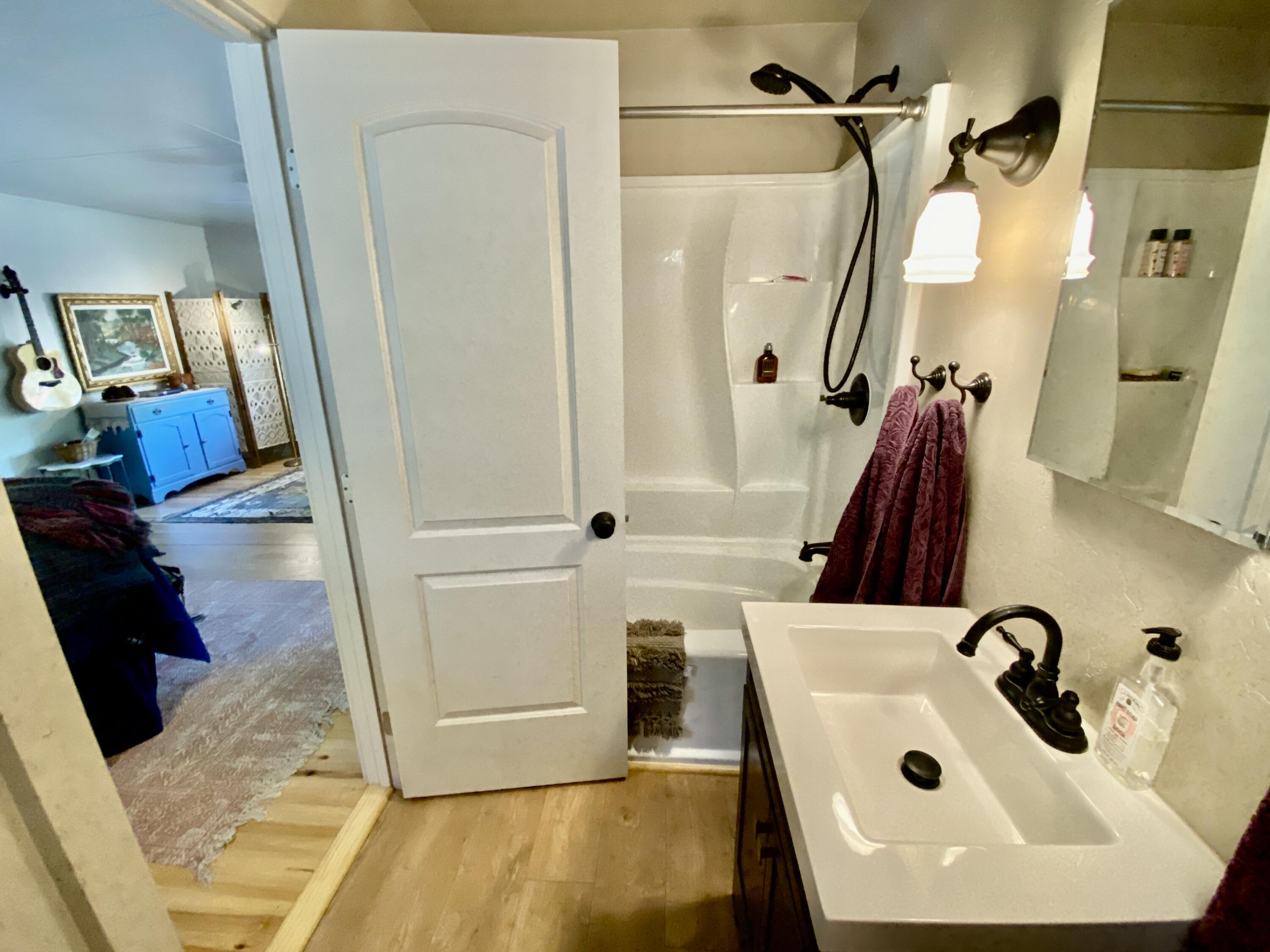 53080 4s02 Idyllwild, CA 92549 - Photo 18 of 77 a bathroom with a sink and a mirror
