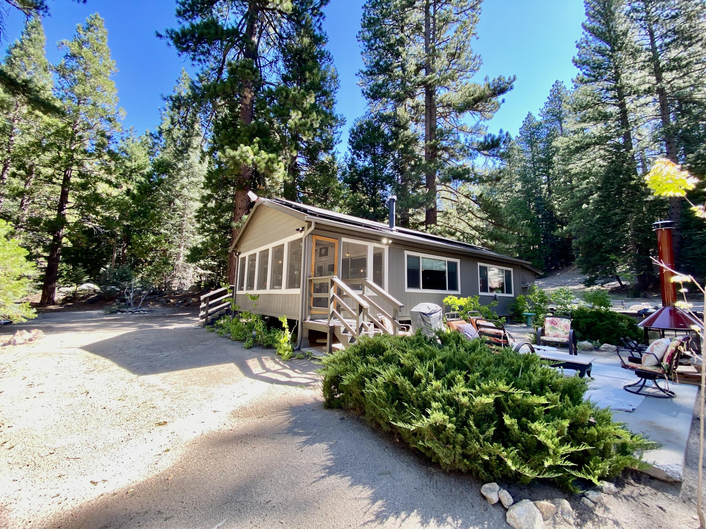 53080 4s02 Idyllwild, CA 92549 - Photo 2 of 77 a front view of a house with a yard and a garden