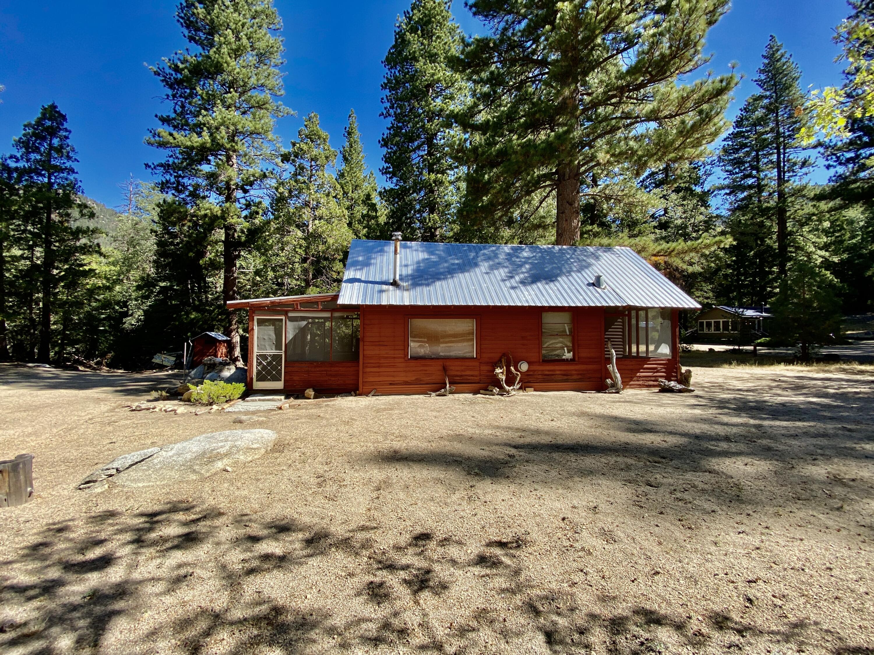 53080 4s02 Idyllwild, CA 92549 - Photo 38 of 77 a view of a house with wooden fence and a tree