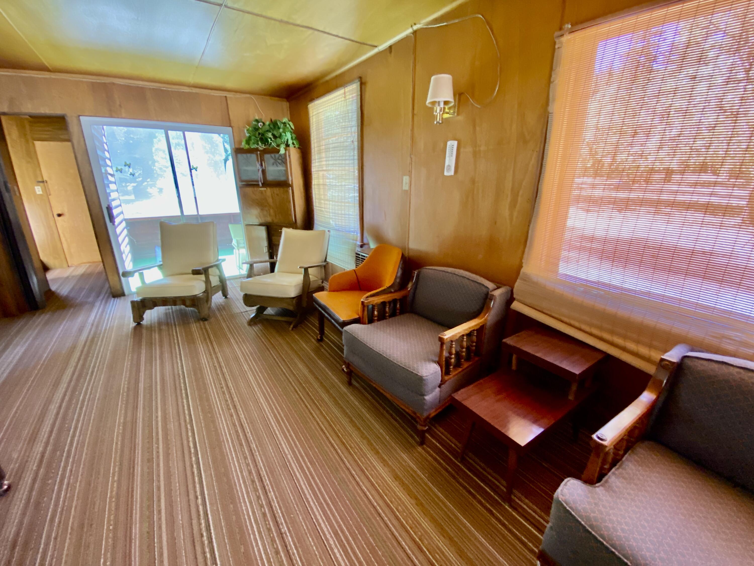 53080 4s02 Idyllwild, CA 92549 - Photo 43 of 77 a living room with furniture and a fireplace