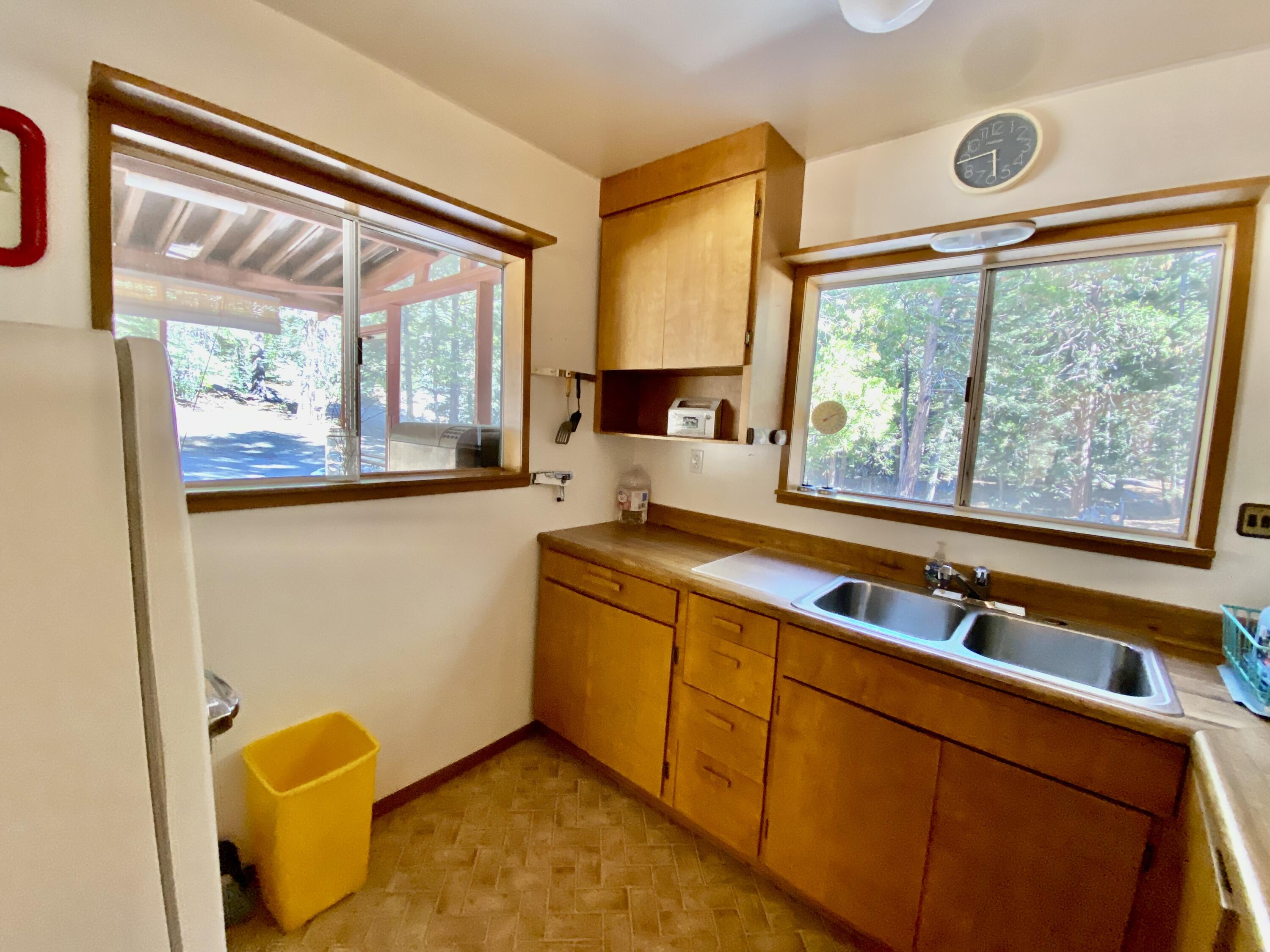 53080 4s02 Idyllwild, CA 92549 - Photo 46 of 77 a kitchen with stainless steel appliances granite countertop a sink and a large window