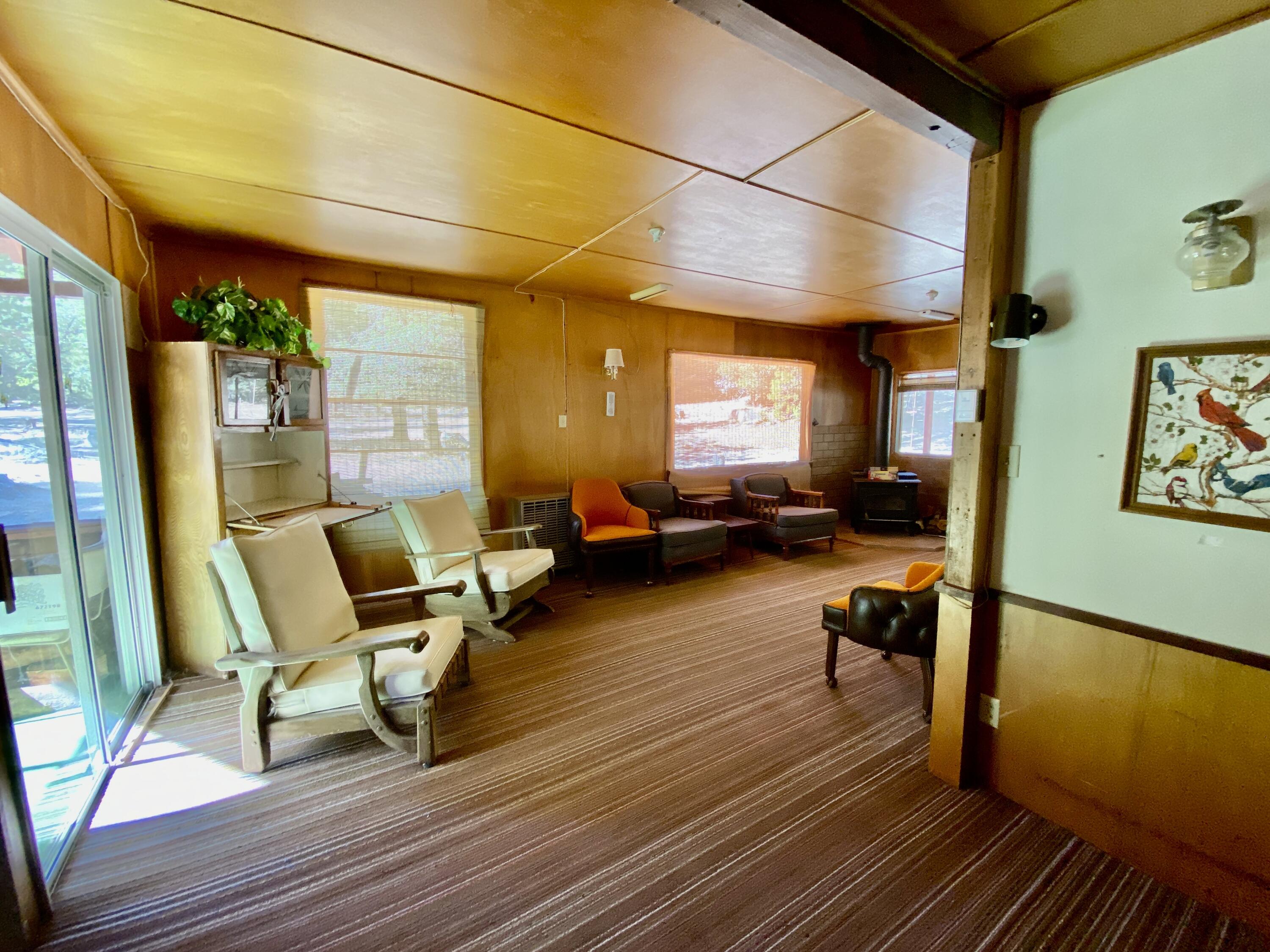 53080 4s02 Idyllwild, CA 92549 - Photo 49 of 77 a living room with furniture a wooden floor and next to a window