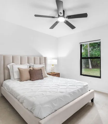 a white toilet sitting next to a bathroom sink and a shower