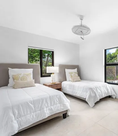 a backyard of a house with palm tree