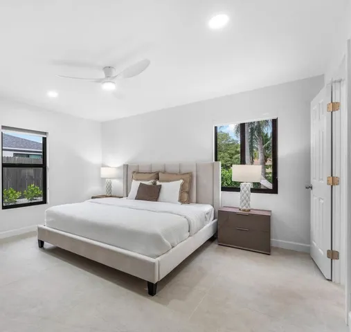 a bedroom with a bed and a couch