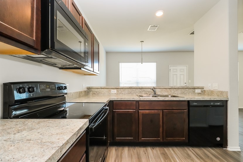 1003 Harper Lane Bryan, TX 77803 - Photo 13 of 15 a kitchen with a stove and a sink