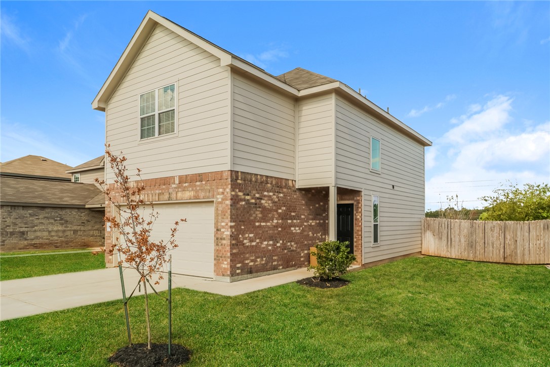 1003 Harper Lane Bryan, TX 77803 - Photo 2 of 15 a view of backyard with a garden and plants