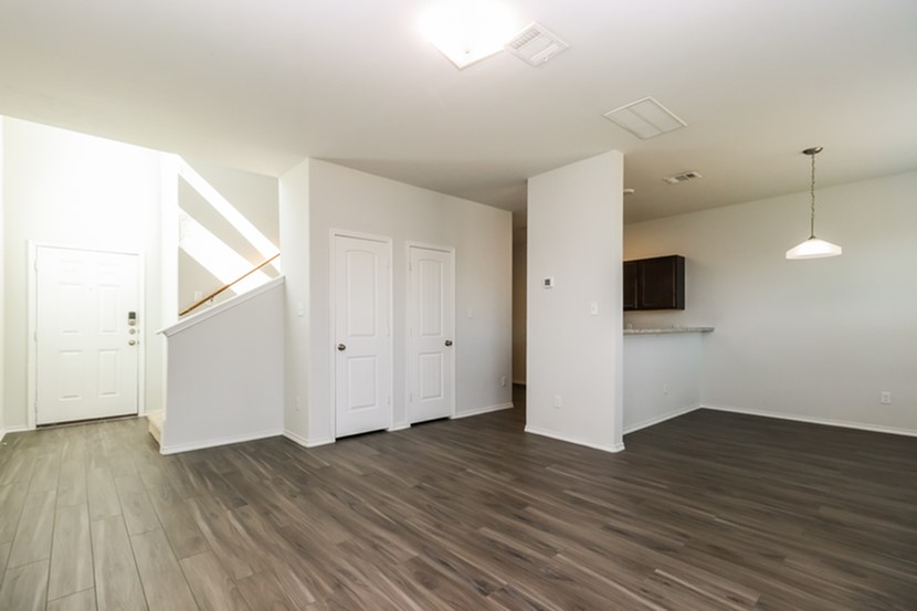 1003 Harper Lane Bryan, TX 77803 - Photo 5 of 15 a view of a room with wooden floor and white walls