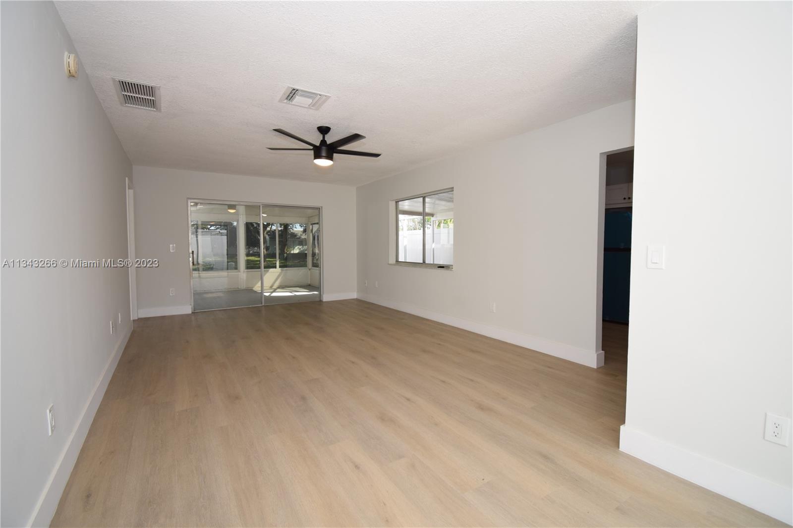 9222 Southwest 5th Street, Unit A Boca Raton, FL 33428 - Photo 4 of 34 a view of an empty room with a window