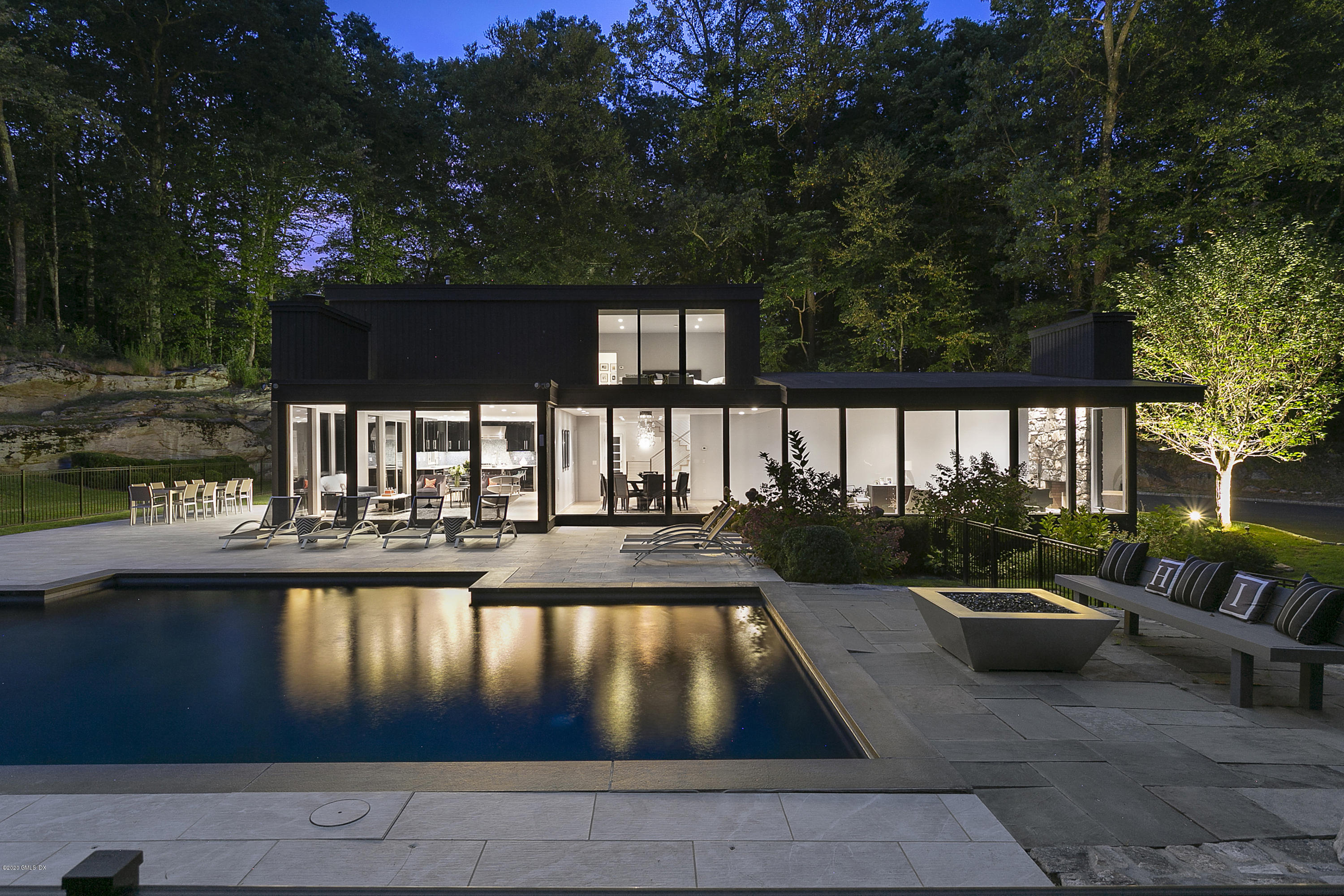 a view of swimming pool with outdoor seating and plants