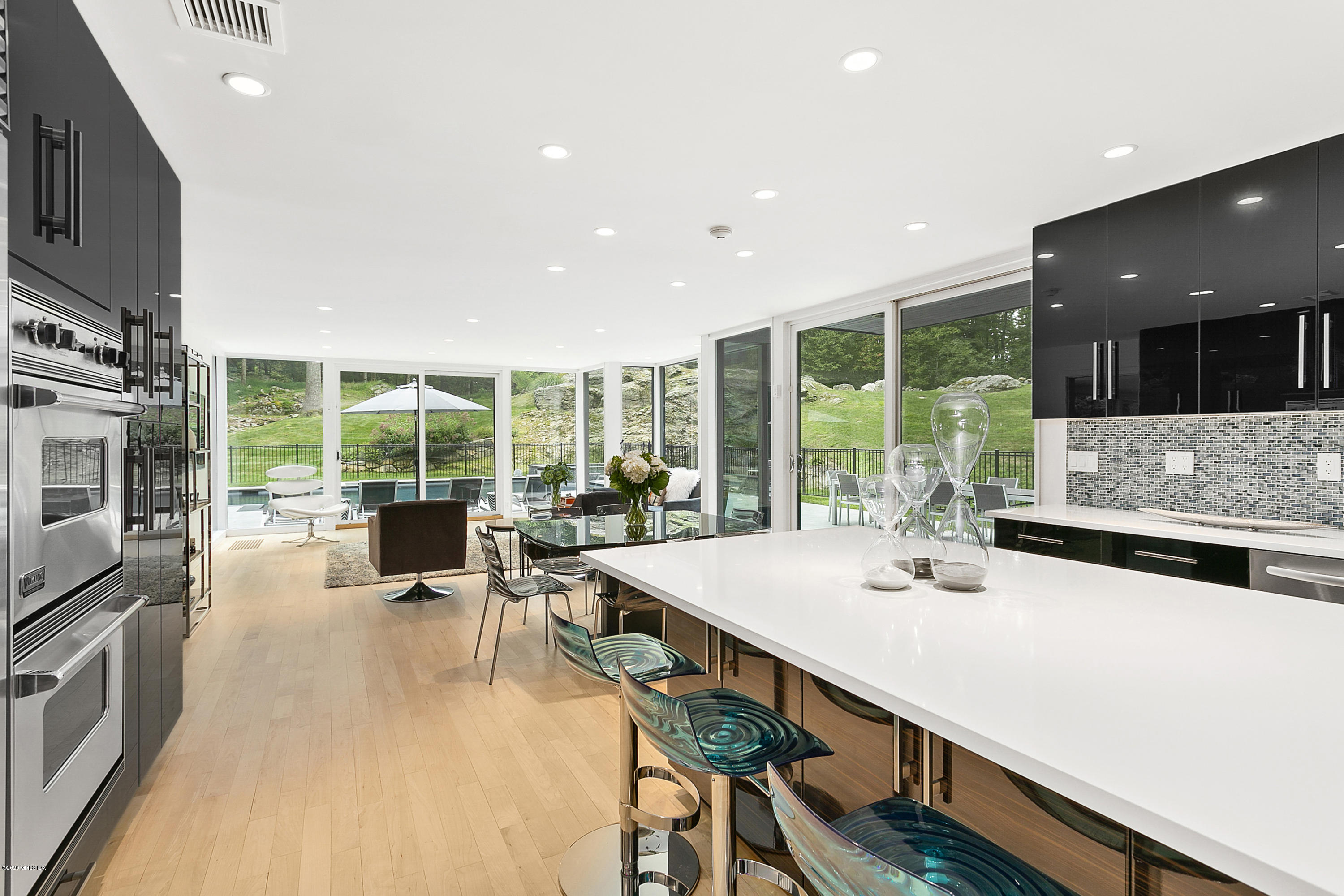 9 Chateau Ridge Drive Greenwich, CT 06831 - Photo 11 of 34 a kitchen with a large window and a view of living room