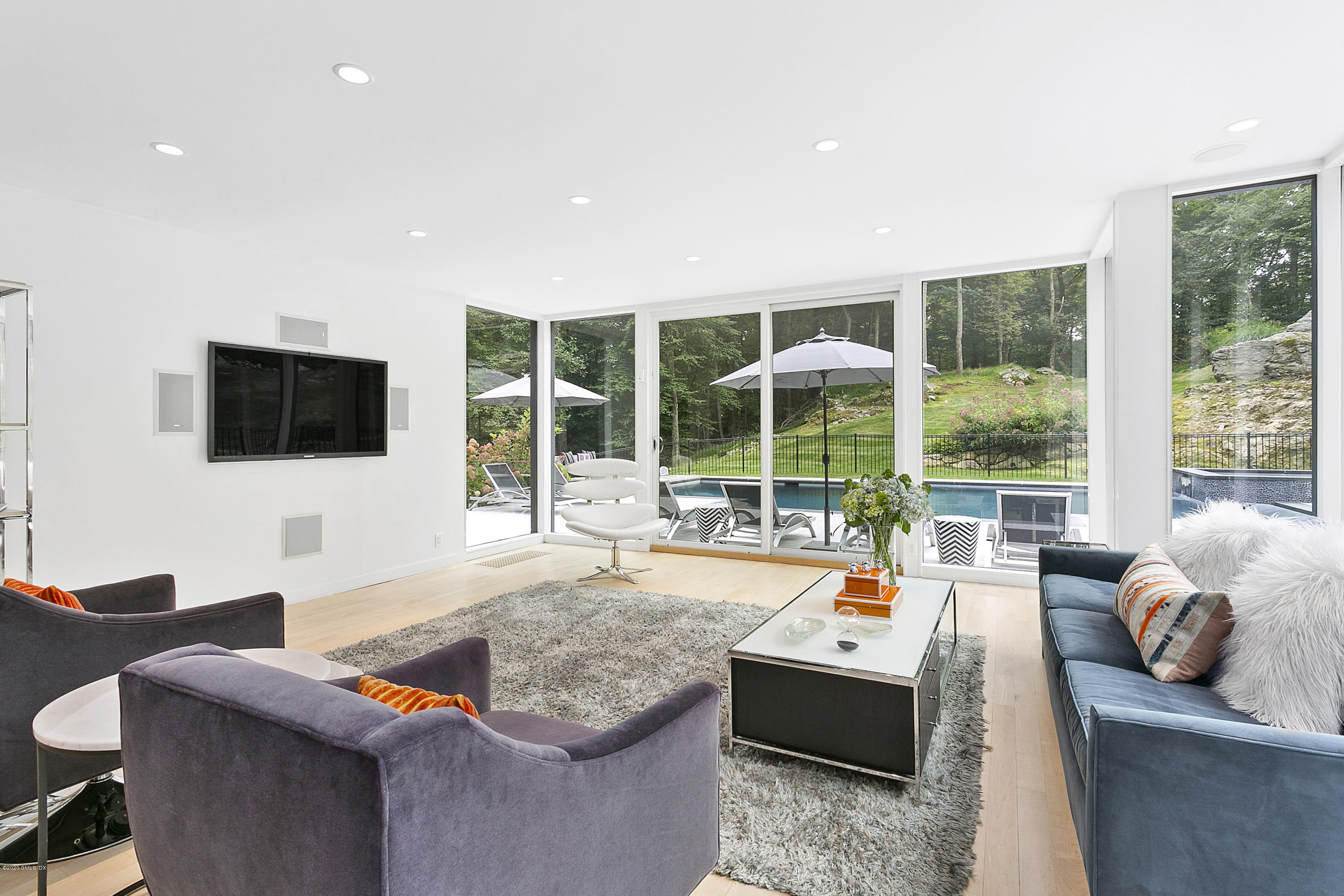 9 Chateau Ridge Drive Greenwich, CT 06831 - Photo 13 of 34 a living room with furniture and a flat screen tv
