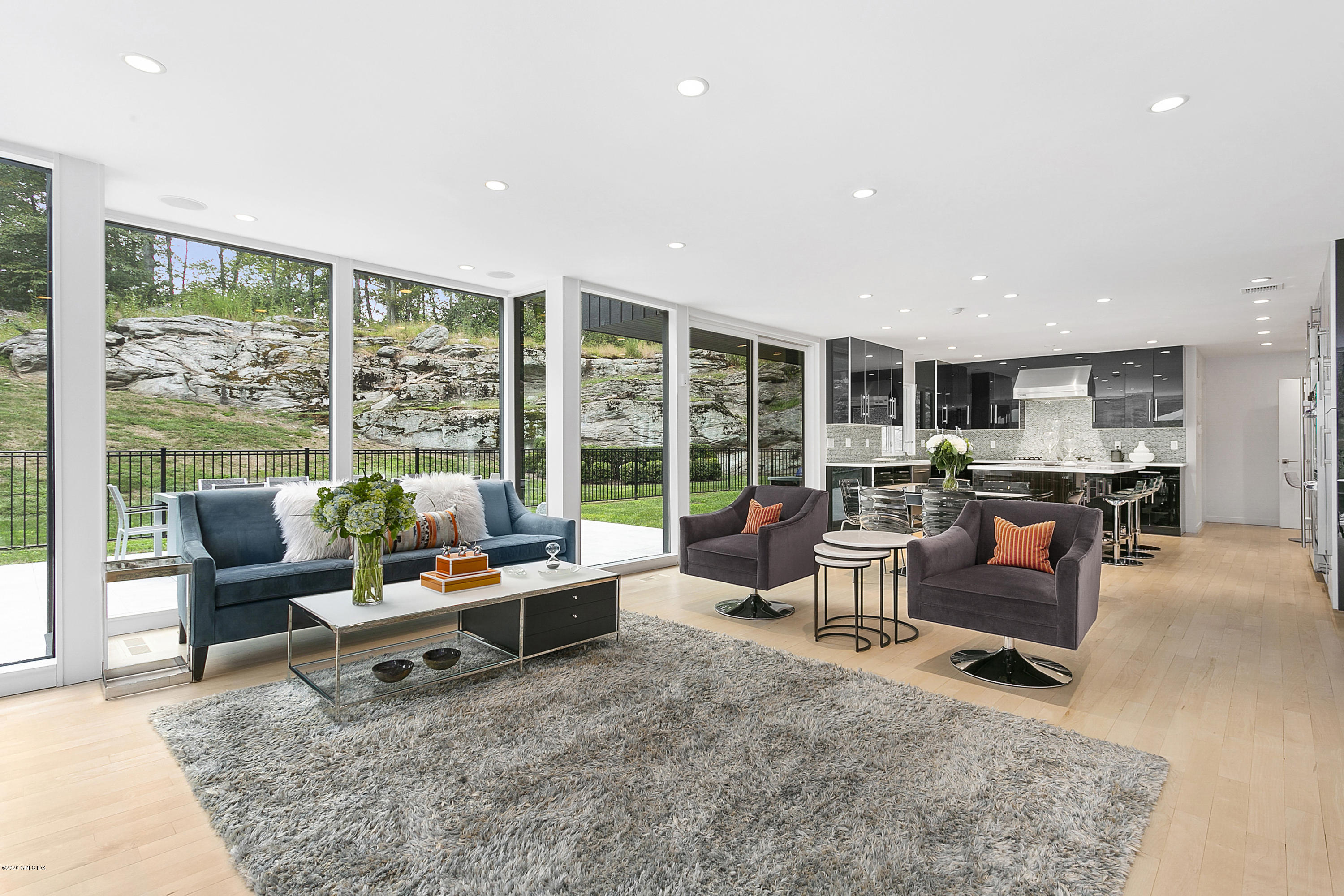 9 Chateau Ridge Drive Greenwich, CT 06831 - Photo 14 of 34 a living room with furniture and floor to ceiling window