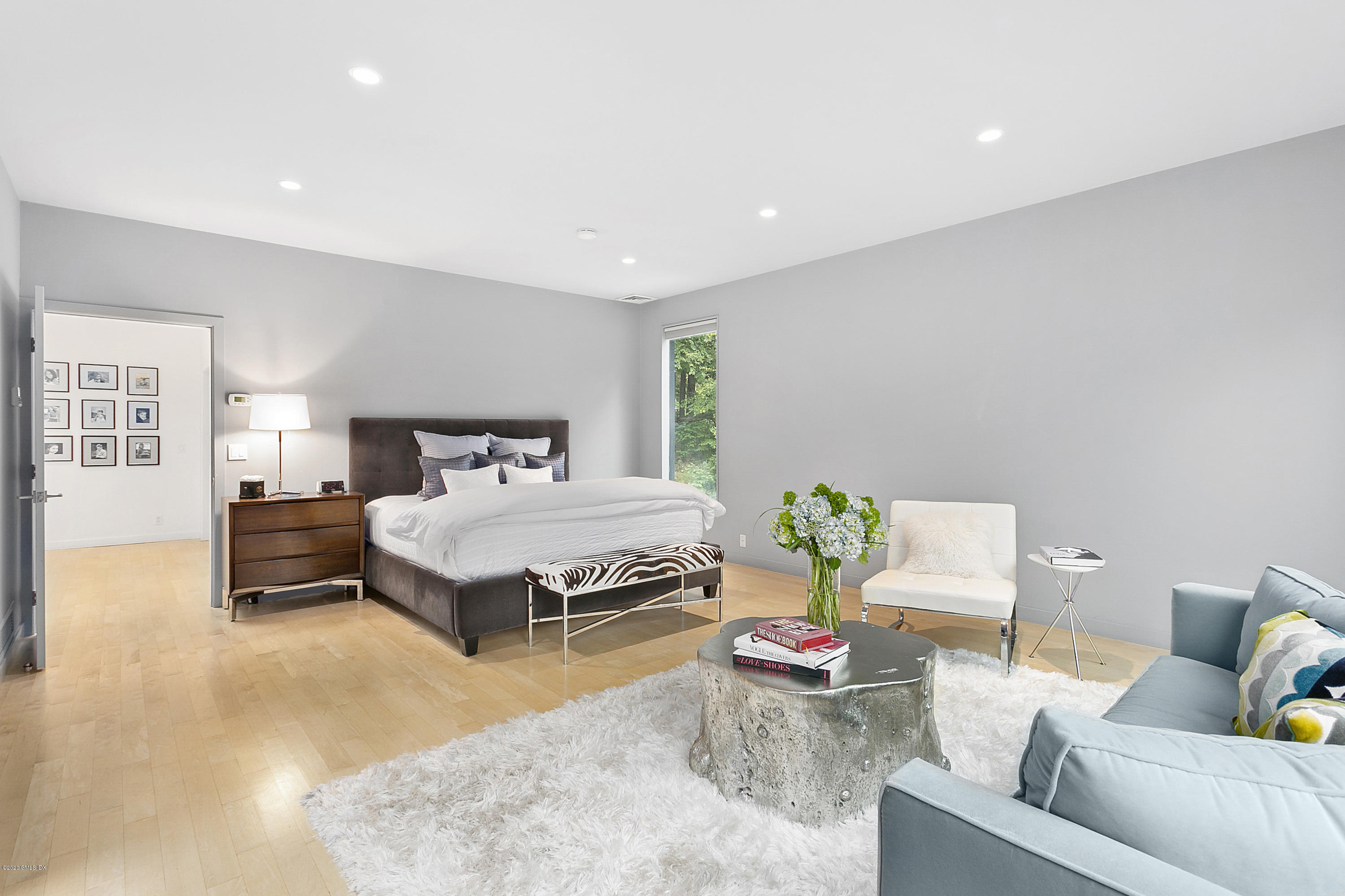 9 Chateau Ridge Drive Greenwich, CT 06831 - Photo 17 of 34 a bedroom with a bed and window