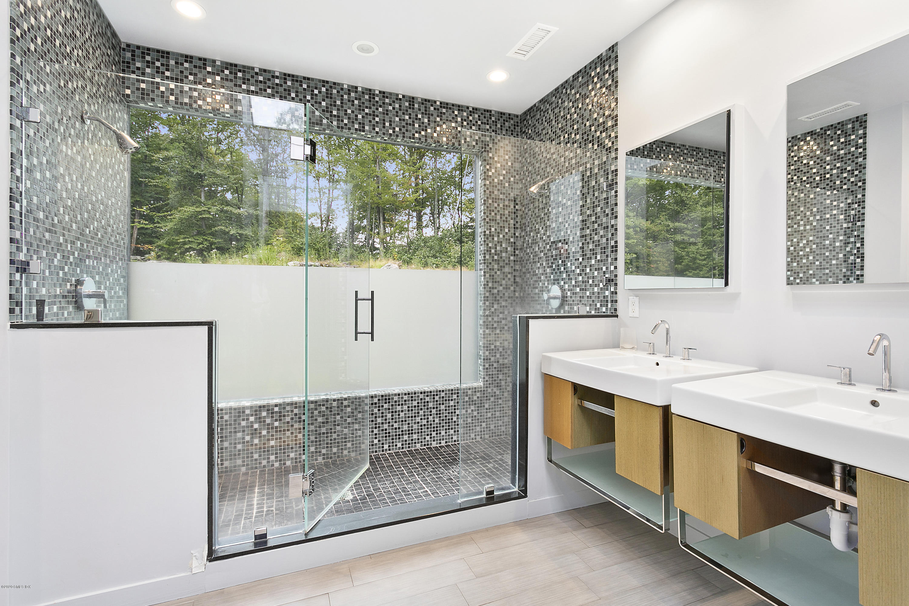 9 Chateau Ridge Drive Greenwich, CT 06831 - Photo 20 of 34 a bathroom with a double vanity sink and a mirror