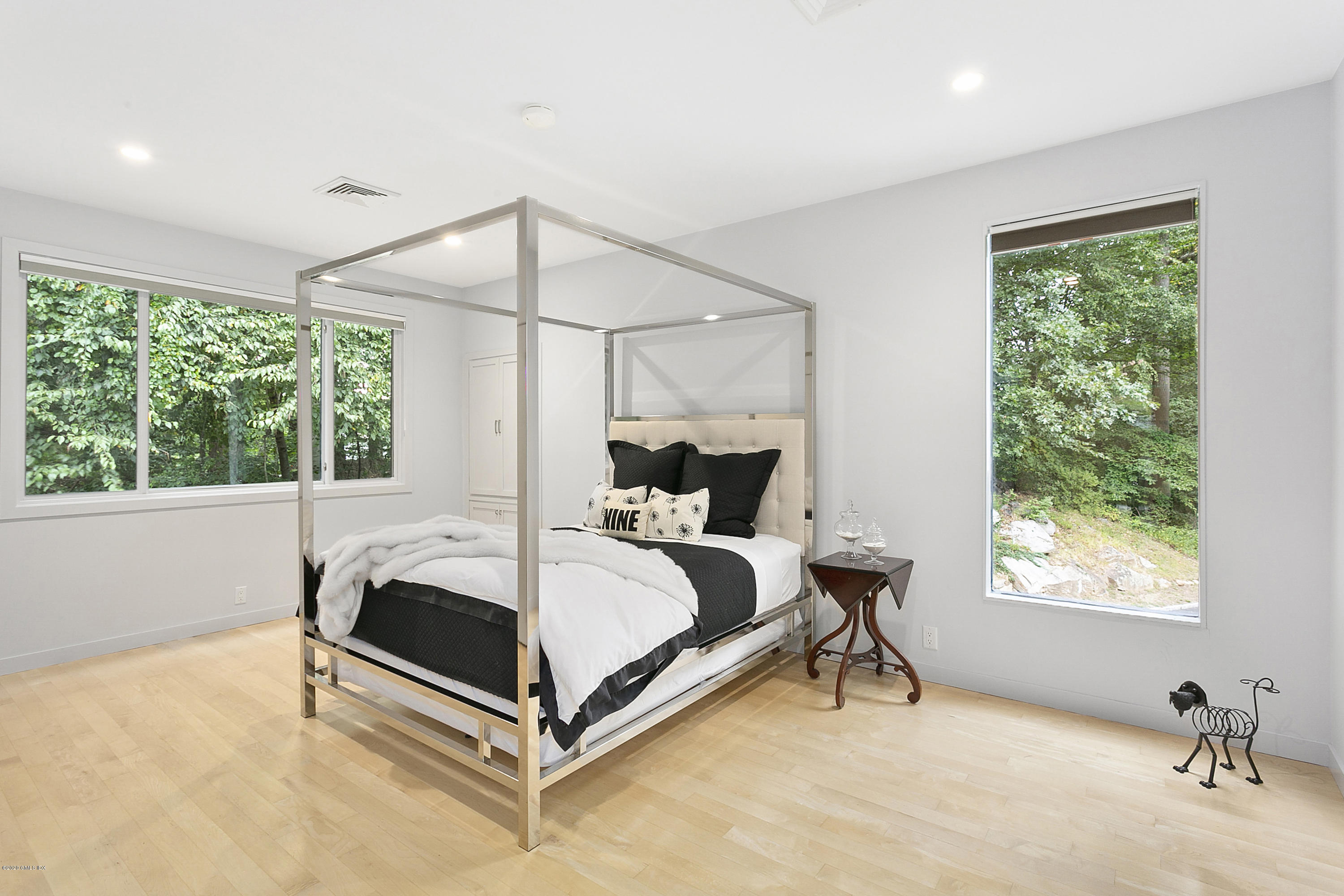 9 Chateau Ridge Drive Greenwich, CT 06831 - Photo 21 of 34 a bed room with a bed and a window