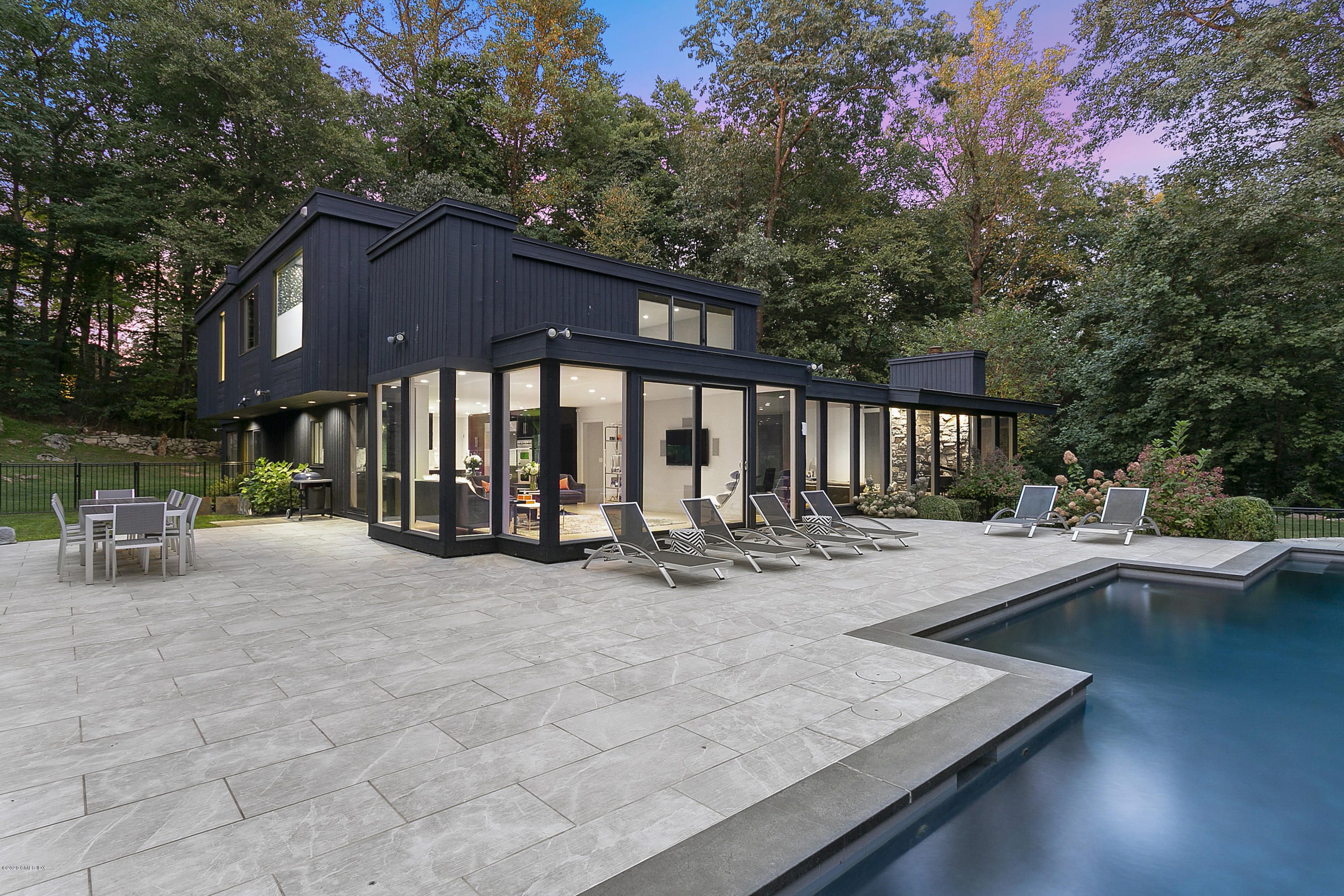 9 Chateau Ridge Drive Greenwich, CT 06831 - Photo 23 of 34 a view of a house with sitting area and garden