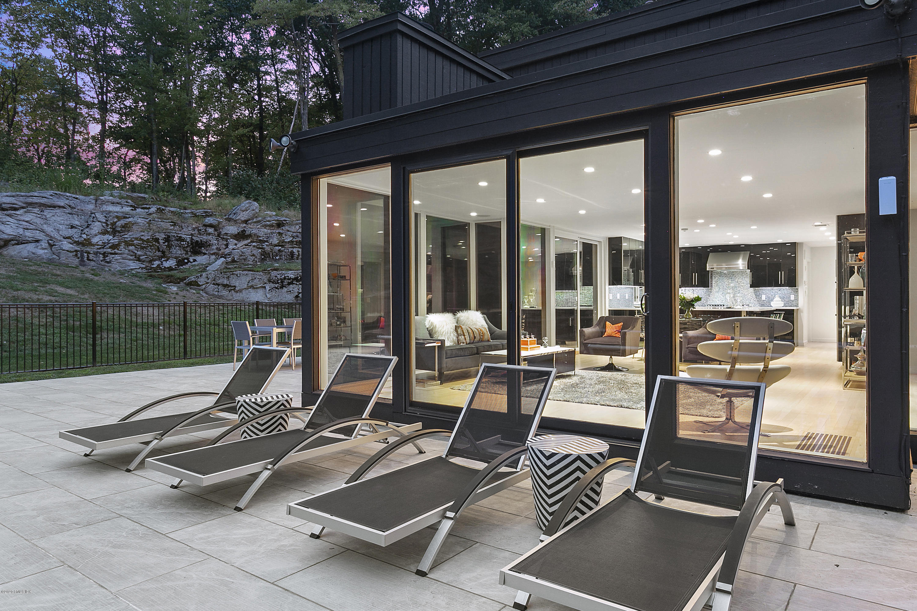 9 Chateau Ridge Drive Greenwich, CT 06831 - Photo 26 of 34 a view of a gym with wooden floor and outdoor space