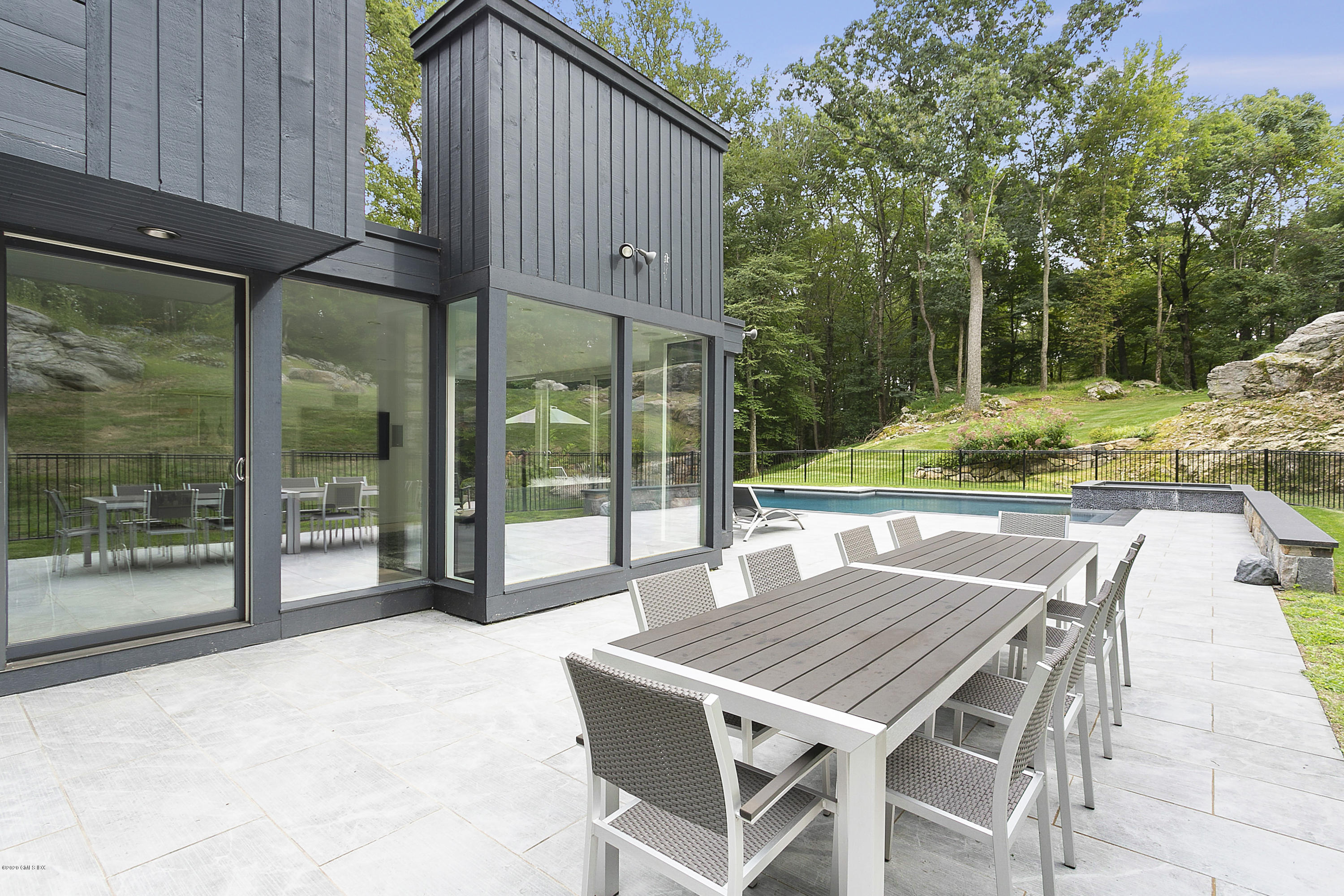 9 Chateau Ridge Drive Greenwich, CT 06831 - Photo 29 of 34 a view of an outdoor dining space with a patio