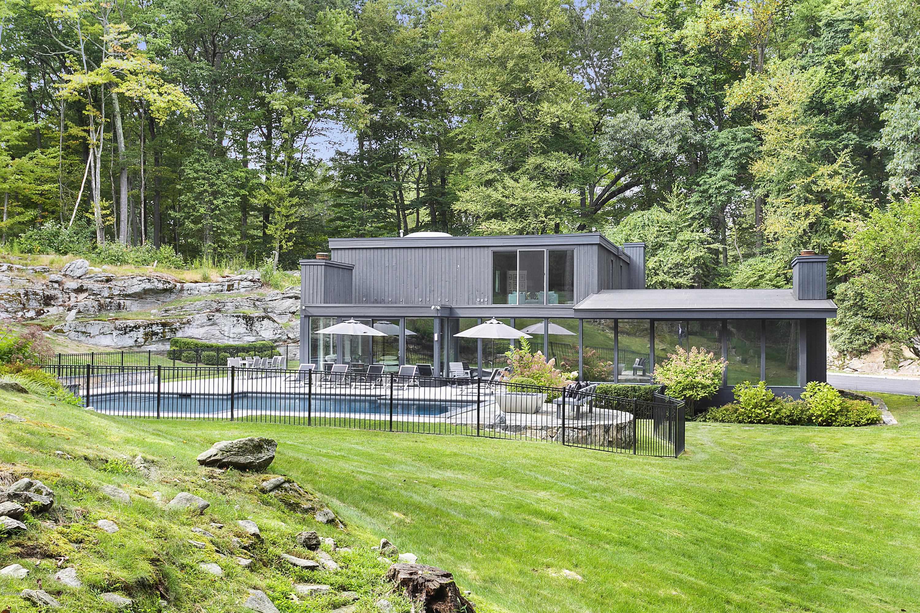 9 Chateau Ridge Drive Greenwich, CT 06831 - Photo 34 of 34 a front view of house with yard and outdoor seating