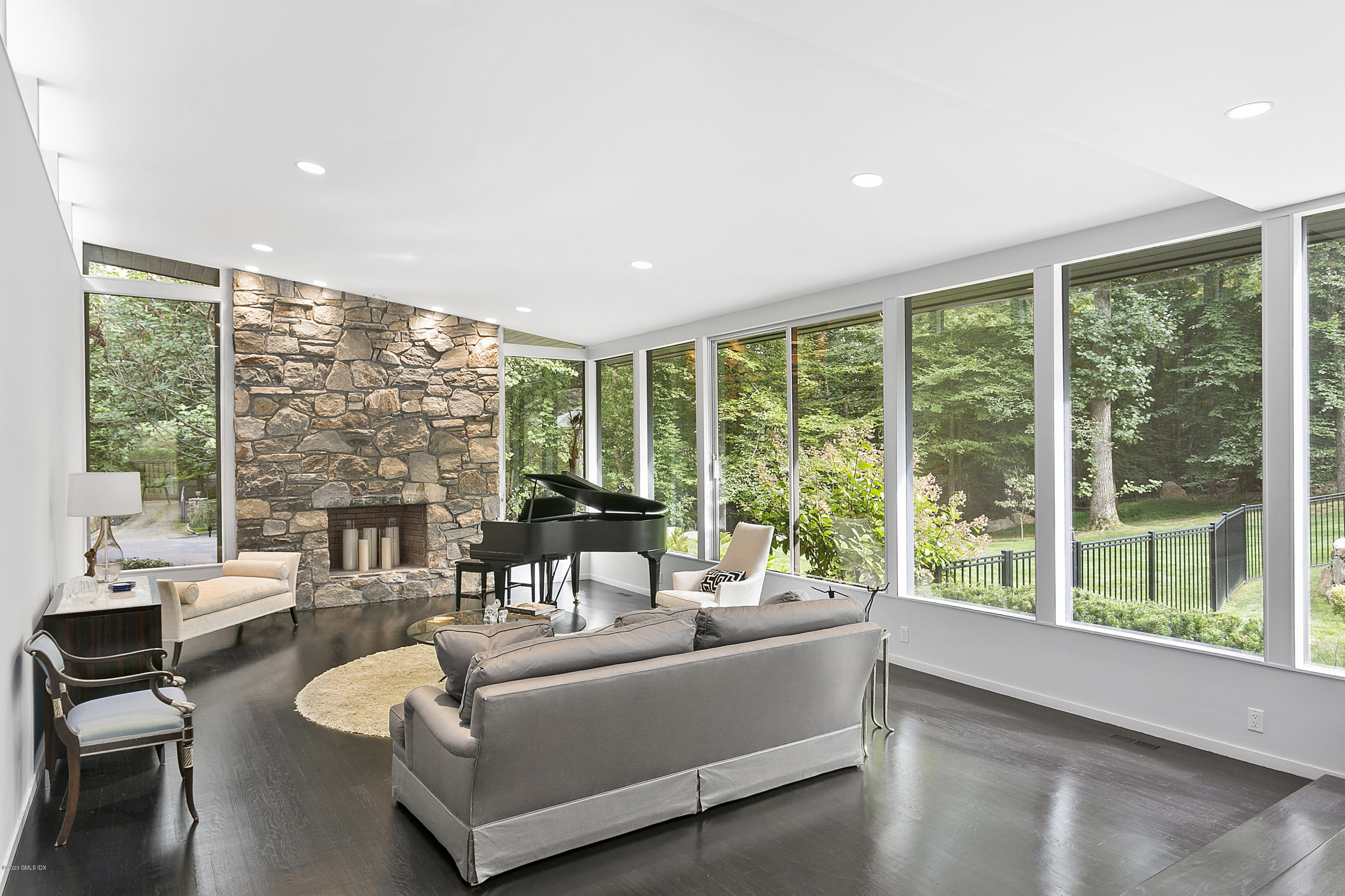 9 Chateau Ridge Drive Greenwich, CT 06831 - Photo 4 of 34 a living room with furniture and a large window