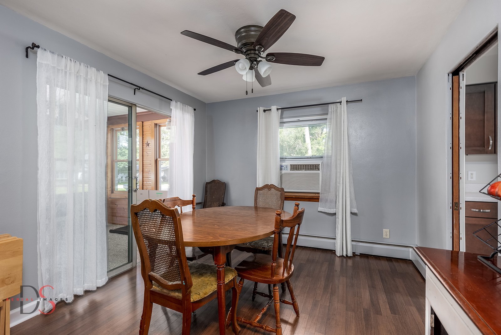 927 Clark Street Marseilles, IL 61341 - Photo 8 of 25 a view of a dining room with furniture window and wooden floor