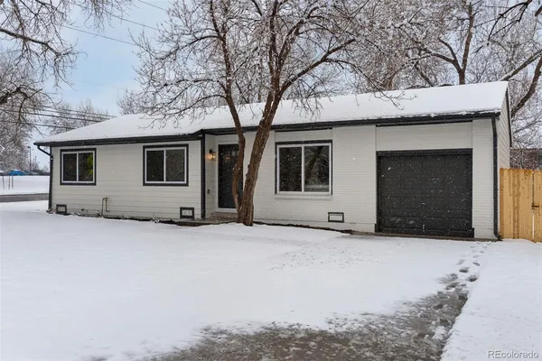 a house with trees in front of it