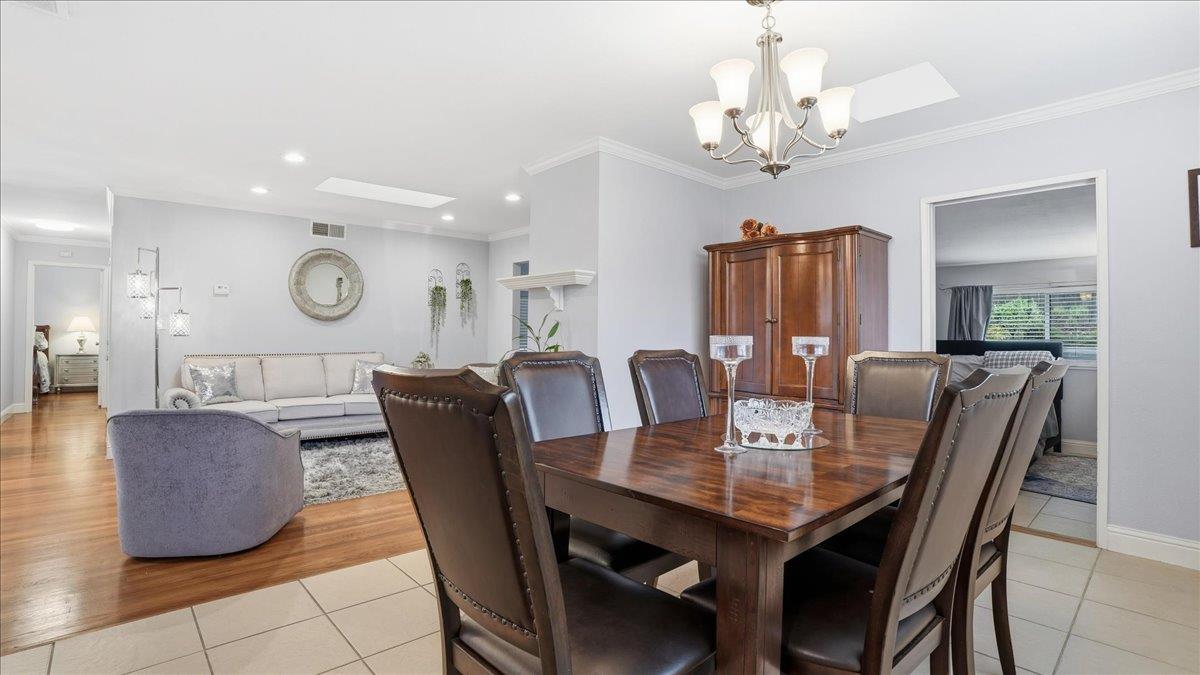 5701 Chipping Way Citrus Heights, CA 95621 - Photo 13 of 41 a view of a dining room with furniture and chandelier